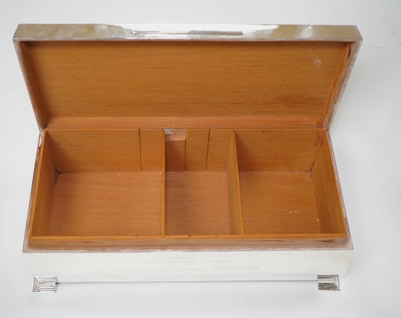 An Elizabeth II part engine turned silver mounted cigarette box, W.T. Toghill & Co, Birmingham, 1957, with engraved inscription, 26.4cm. Condition - fair to good